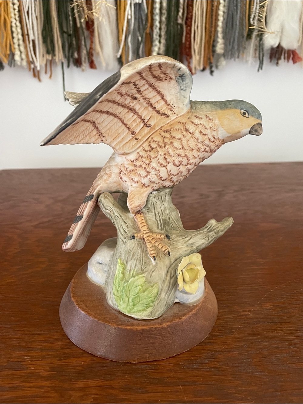Ceramic bird figurine on wood base